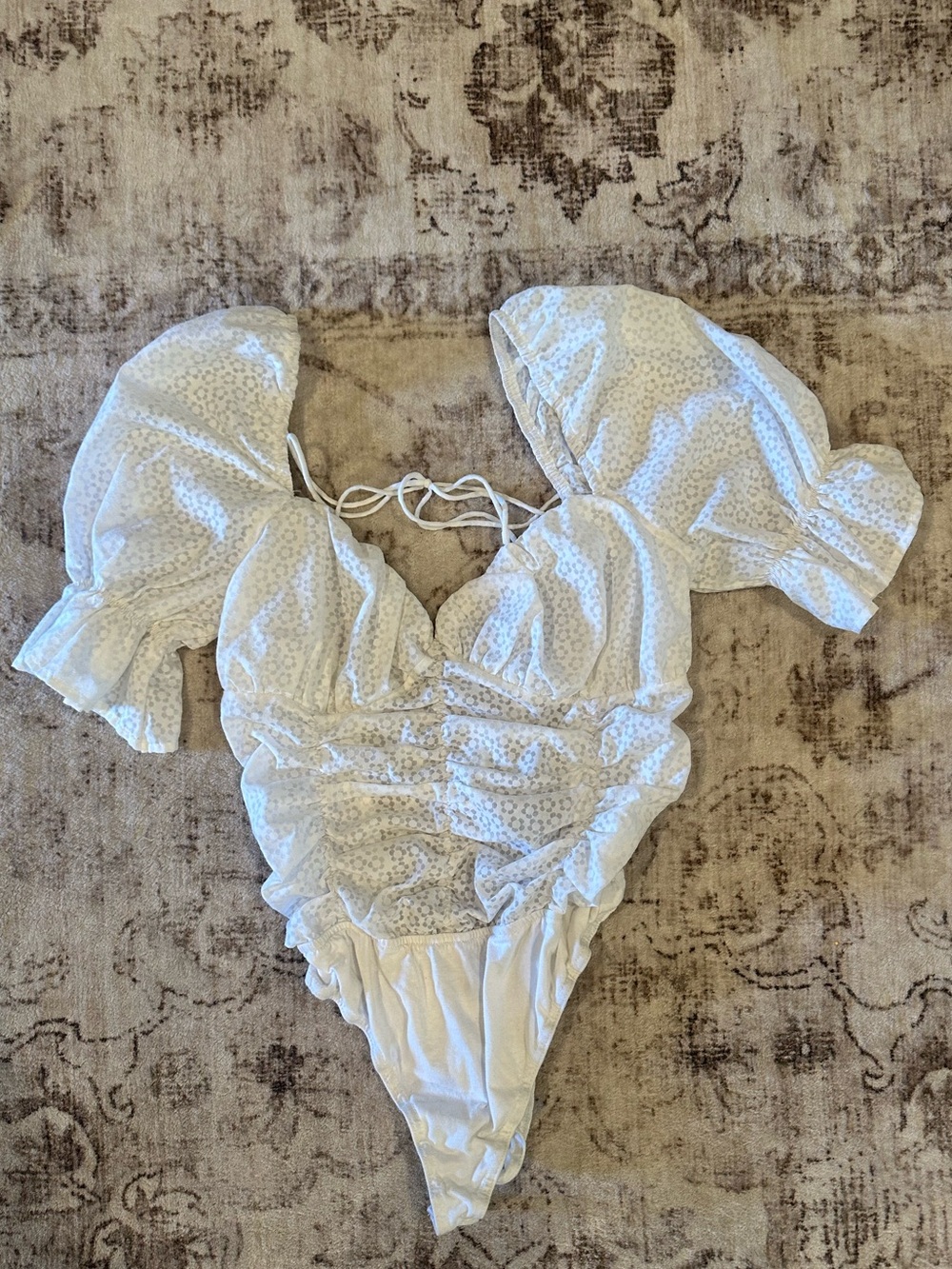 White Ruched Puff Sleeve One-Piece Top. Tag says M but fits more like a small!